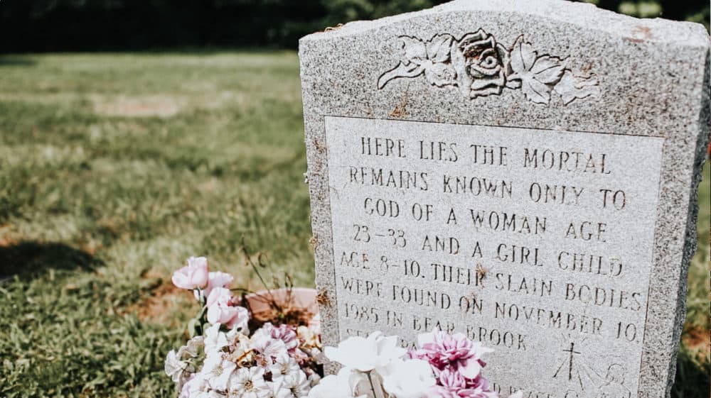 A headstone in an Allenstown cemetery honors two of the Bear Brook victims identified by New Hampshire investigators Thursday. (Allie Gutierrez for NHPR)