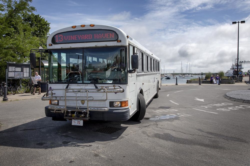 A Martha's Vineyard Transit Authority bus pulls out of the bus stop at the Vineyard Haven ferry dock. (Robin Lubbock/WBUR)