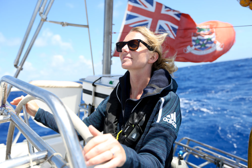 Emily Penn, eXXpedition mission director, at the helm during the North Pacific mission in 2018. (Courtesy of Eleanor Church Lark Rise Pictures)