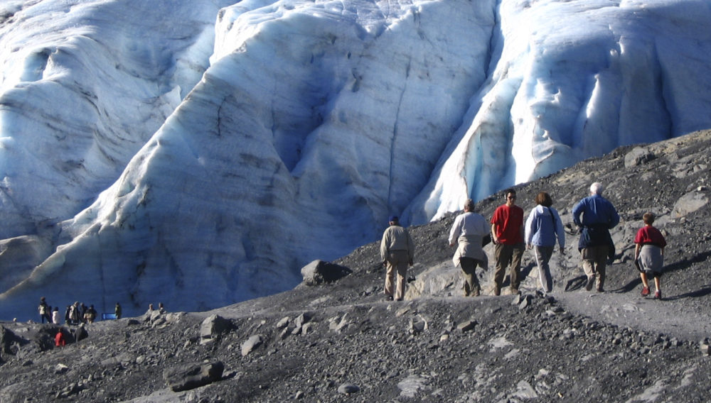 This August 2007 file photo shows hikers in Kenai Fjords National Park in Seward, Alaska on the path leading to the toe of Exit Glacier. (Beth Harpaz/AP)