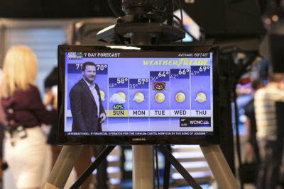 Dale Earnhardt Jr. delivers a surprise seven-day forecast at a Charlotte news station ahead of weekend NASCAR race in Martinsville to help launch Goodyear's new WeatherReady tire on Friday, Oct. 27, 2017, in Charlotte, N.C. (Jason Walle/AP Images for Goodyear)