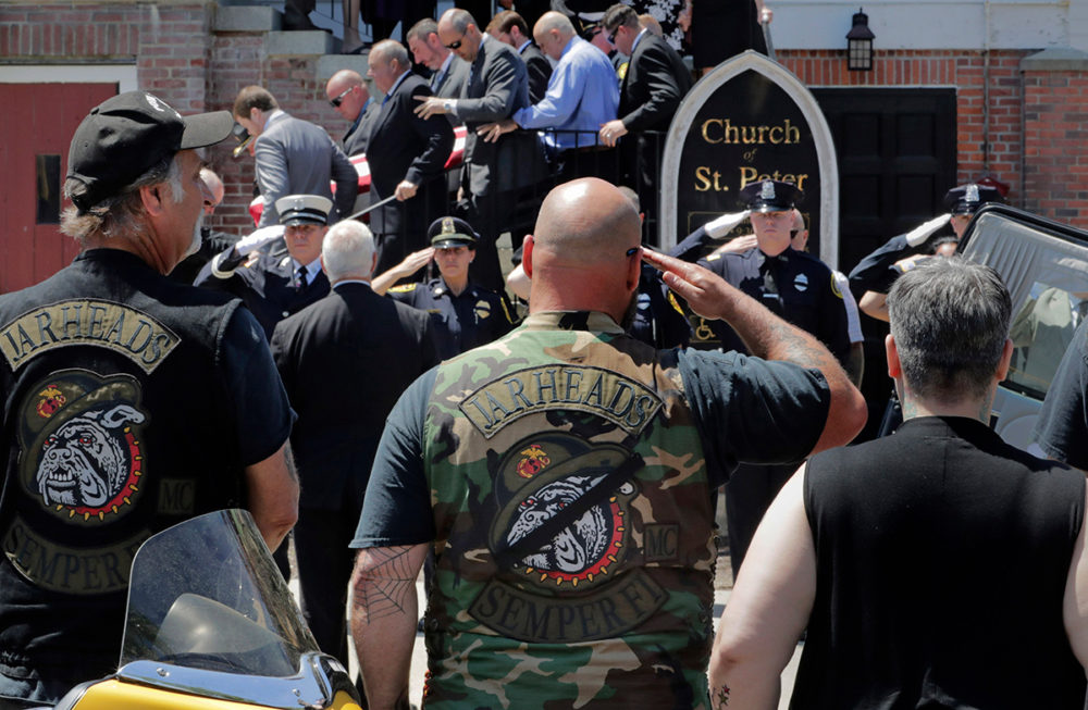 Members of the Jarheads Motorcycle Club and a police honor guard salute as the casket of Michael Ferazzi is loaded into a hearse outside St. Peter's Catholic Church in Plymouth, Mass., Friday, June 28, 2019. (Charles Krupa/AP Photo)