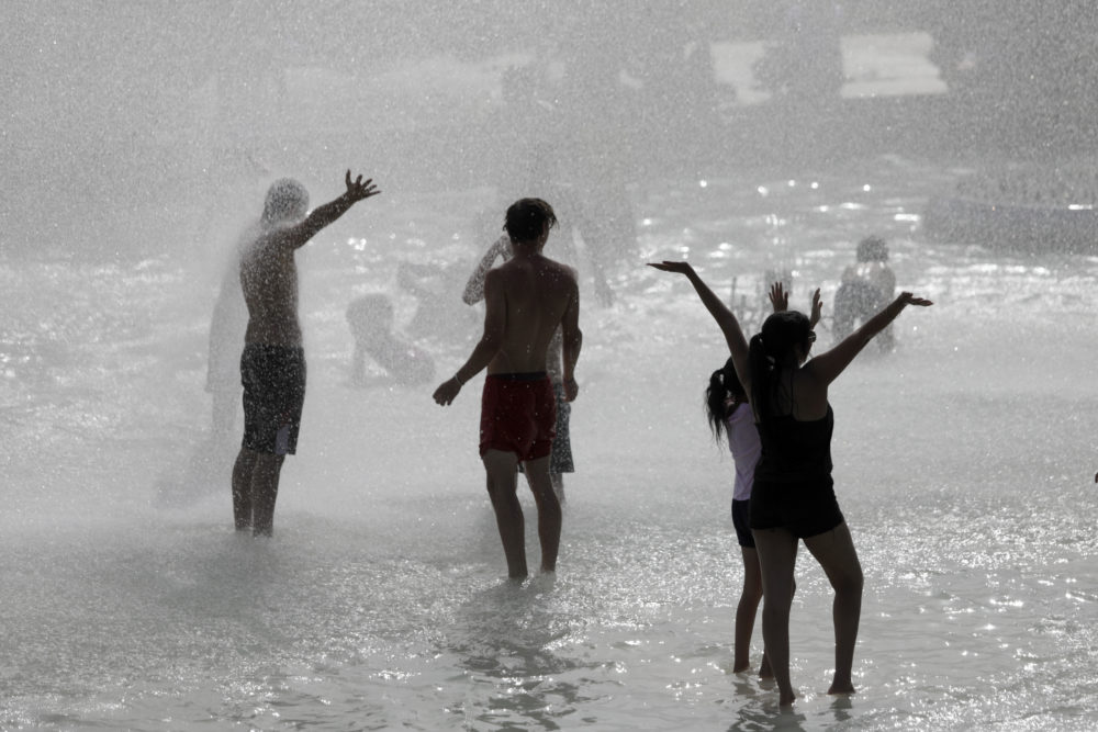People play in the fountains of the Trocadero gardens in Paris, Friday, June 28, 2019. (Lewis Joly/AP)