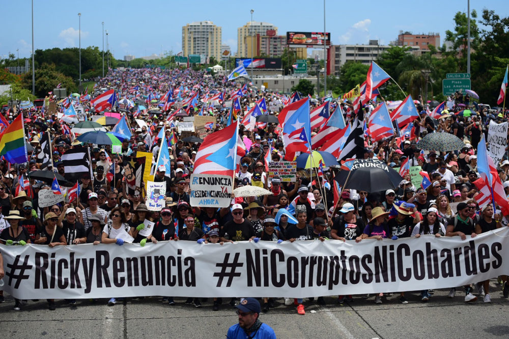 Thousands of Puerto Ricans gather for what many are expecting to be one of the biggest protests ever seen in the U.S. territory, with irate islanders pledging to drive Gov. Ricardo Rossello from office, in San Juan, Puerto Rico, Monday, July 22, 2019. (Carlos Giusti/AP)
