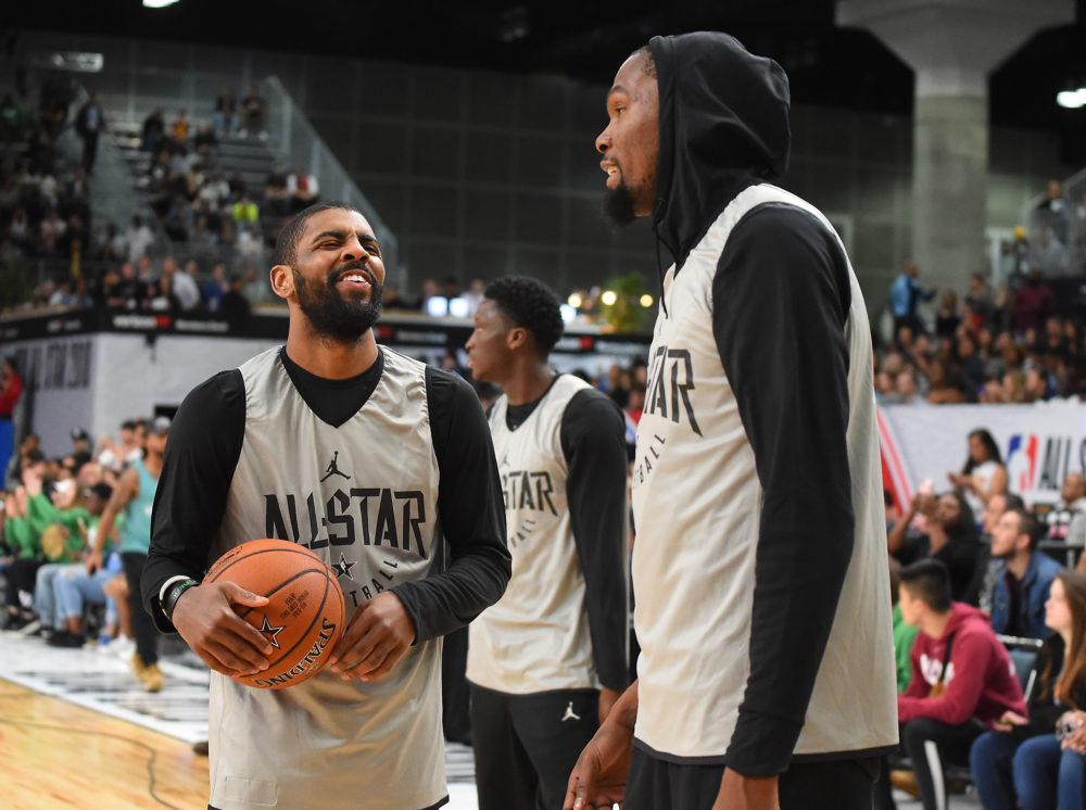 Kyrie Irving and Kevin Durant laugh during practice for the 2018 NBA All-Star game in February. (Jayne Kamin-Oncea/Getty Images)