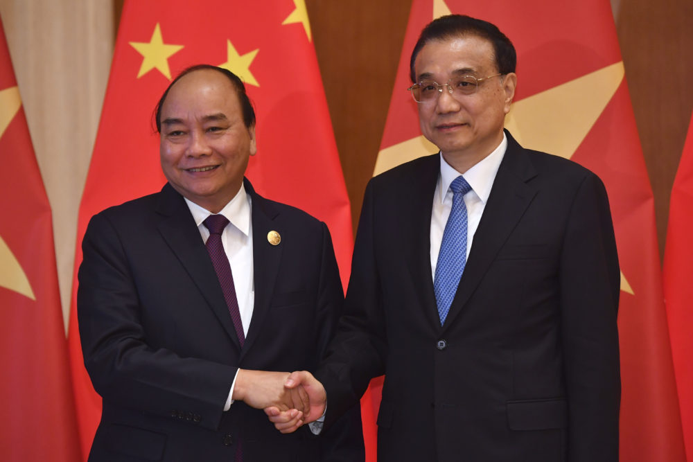 Vietnam's Prime Minister Nguyen Xuan Phuc, left, shakes hands with Chinese Premier Li Keqiang as they pose for media before their meeting on April 26, 2019 in Beijing, China. (Parker Song/Getty Images)