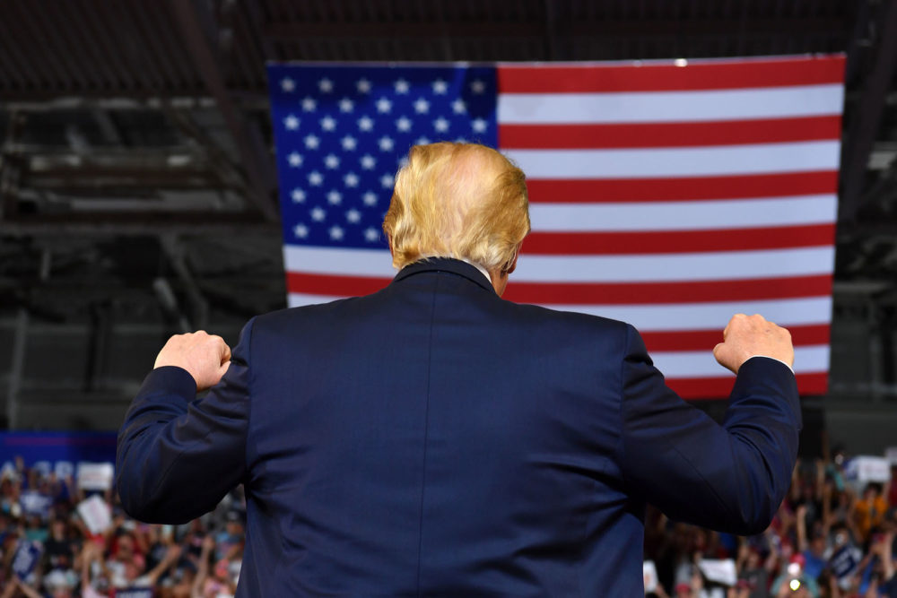President pumps his fists as he arrives for a &quot;Make America Great Again&quot; rally at Minges Coliseum in Greenville, N.C., on July 17, 2019. (Nicholas Kamm/AFP/Getty Images)