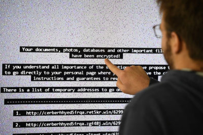 An IT researcher shows on a giant screen a computer infected by a ransomware in Rennes, France on Nov. 3, 2016. (Damien Meyer/AFP/Getty Images)