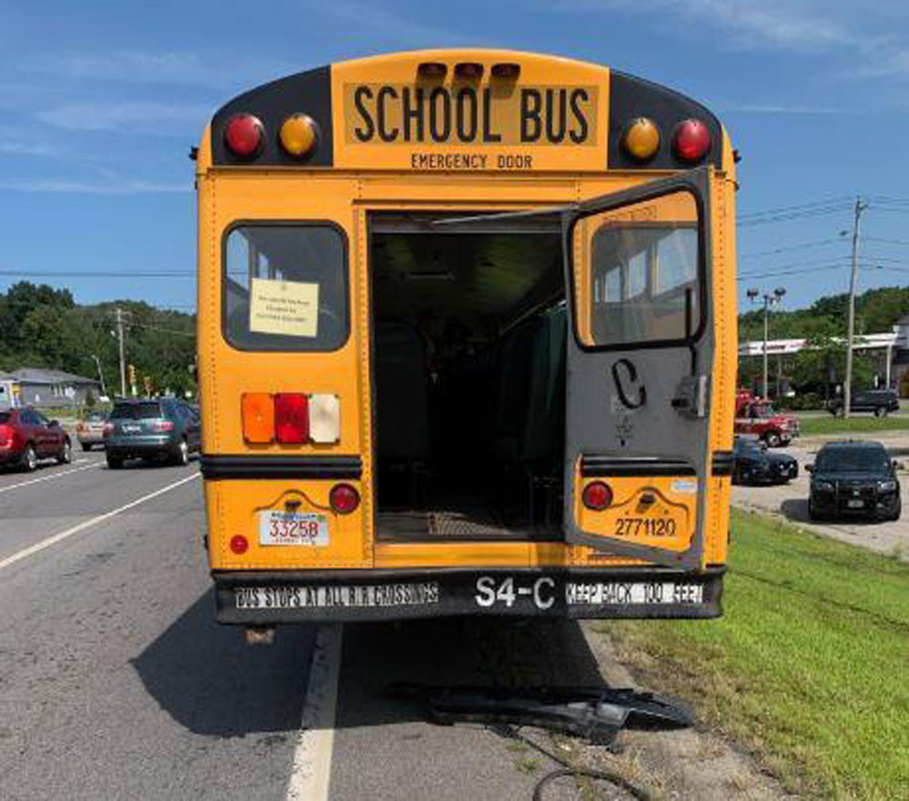 A school bus collided with a pickup and a dump truck in New Hampshire on Thursday. (Courtesy Salem, N.H. Police Department.)