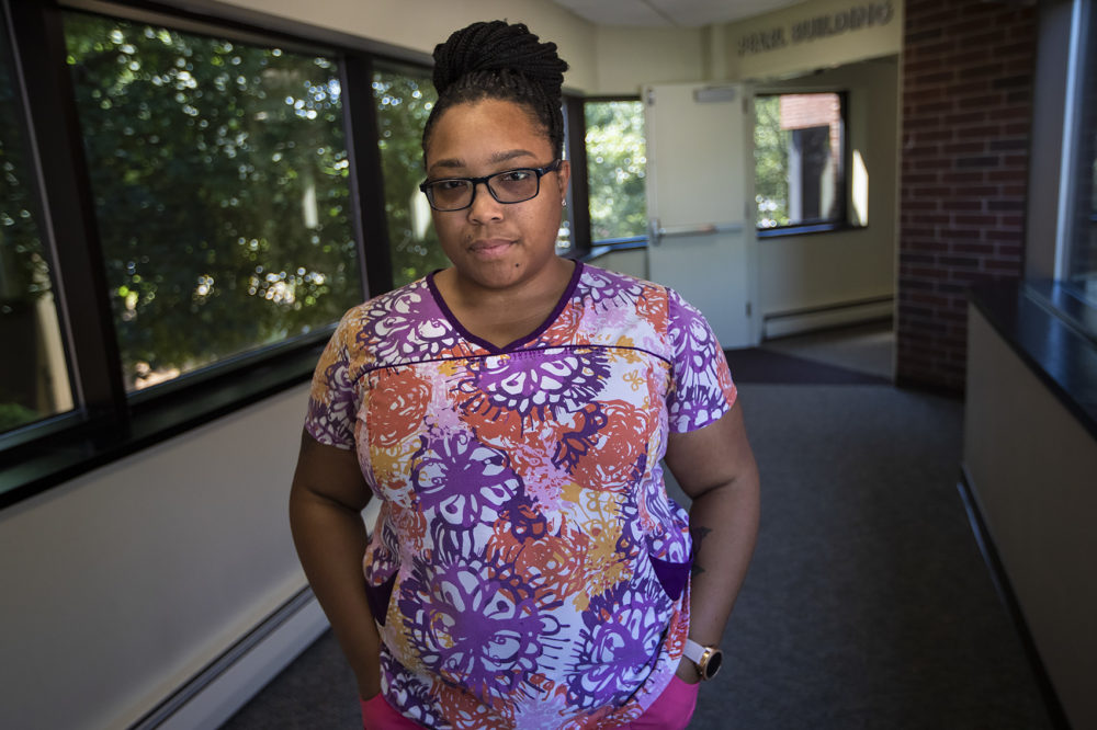 Krystle Callender is a medical assistant at Pearl Street Medical Center in Brockton. She only needed two more semesters of classes at Roxbury Community College to complete her degree. In order to get her license, she will need to start over at another school. (Jesse Costa/WBUR)