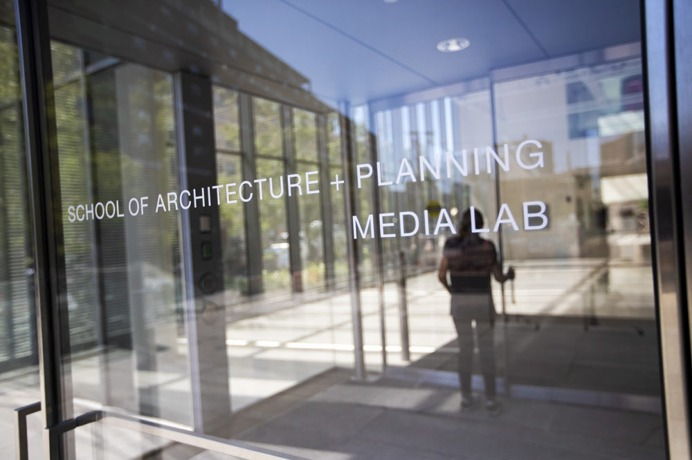 A woman walks through the entrance of the MIT Media Lab. (Jesse Costa/WBUR)