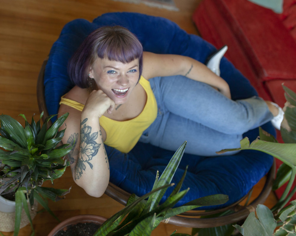 Photographer Ally Schmaling (they/them) wants to create spaces for people to feel curious and compassionate toward their own bodies. (OJ Slaughter for WBUR)
