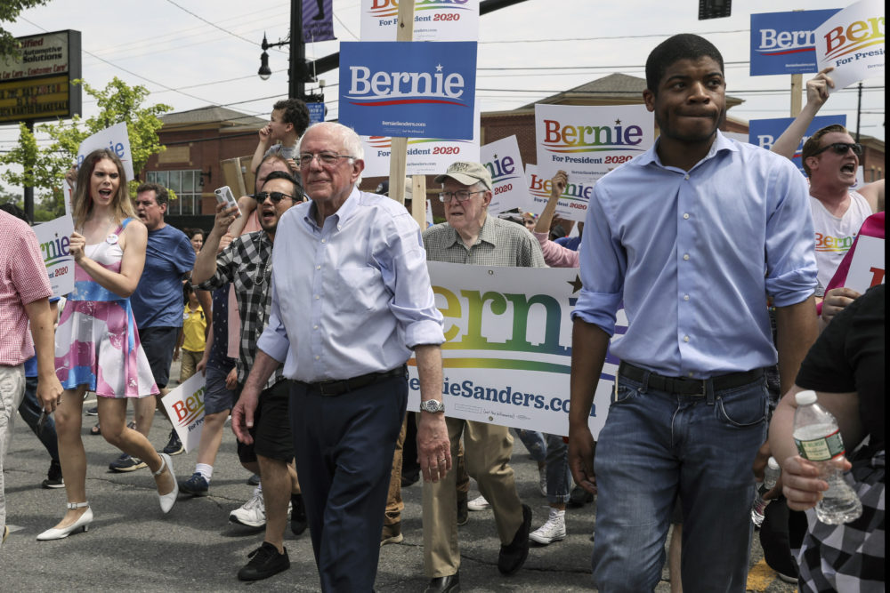 Democratic presidential candidate Sen. Bernie Sanders walks with supporters in the Nashua Pride Parade in Nashua, N.H. on June 29, 2019. (Cheryl Senter/AP)