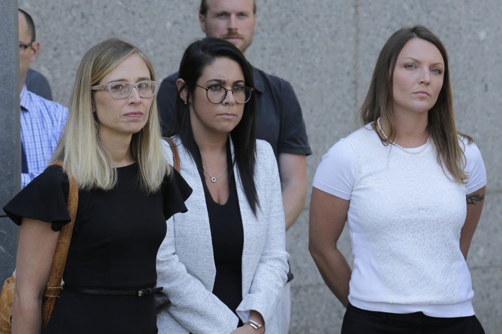Annie Farmer, left, and Courtney Wild, right, accusers of Jeffery Epstein, stand outside the courthouse in New York, Monday, July 15, 2019. (Seth Wenig/AP)