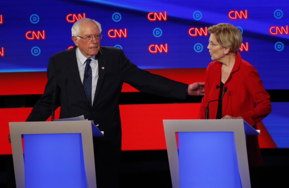Sen. Bernie Sanders gestures toward Sen. Elizabeth Warren during a Democratic presidential debate on July 30 in Detroit. (Paul Sancya/AP)