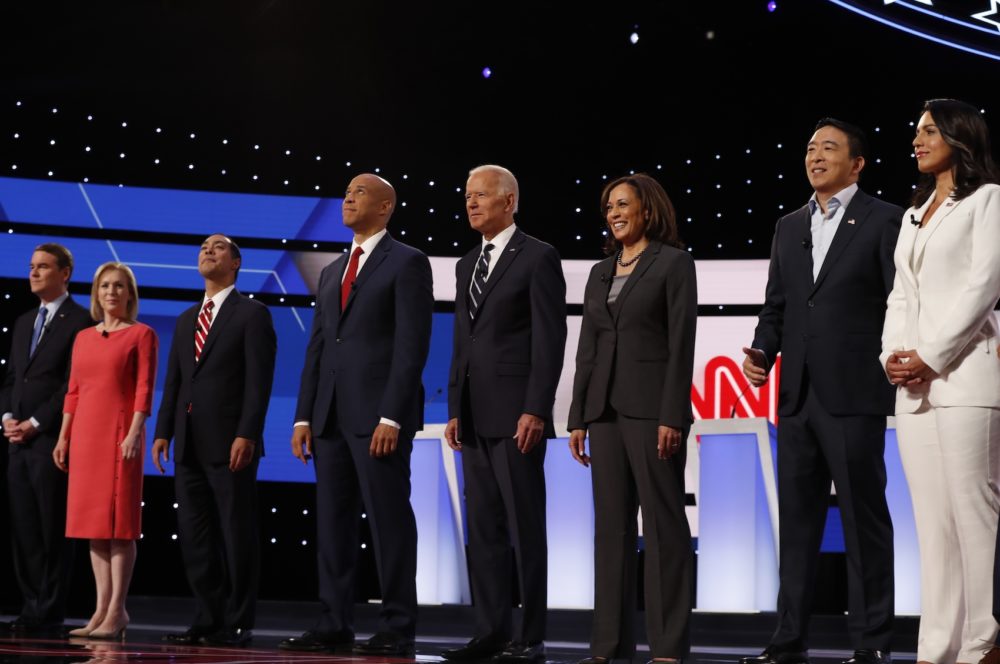 From left, Sen. Michael Bennet, D-Colo., Sen. Kirsten Gillibrand, D-N.Y., former HUD Secretary Julian Castro, Sen. Cory Booker, D-N.J., former Vice President Joe Biden, Sen. Kamala Harris, D-Calif., Andrew Yang and Rep. Tulsi Gabbard, D-Hawaii, are introduced before the second of two Democratic presidential primary debates hosted by CNN Wednesday, July 31, 2019, in the Fox Theatre in Detroit. (Carlos Osorio/AP)