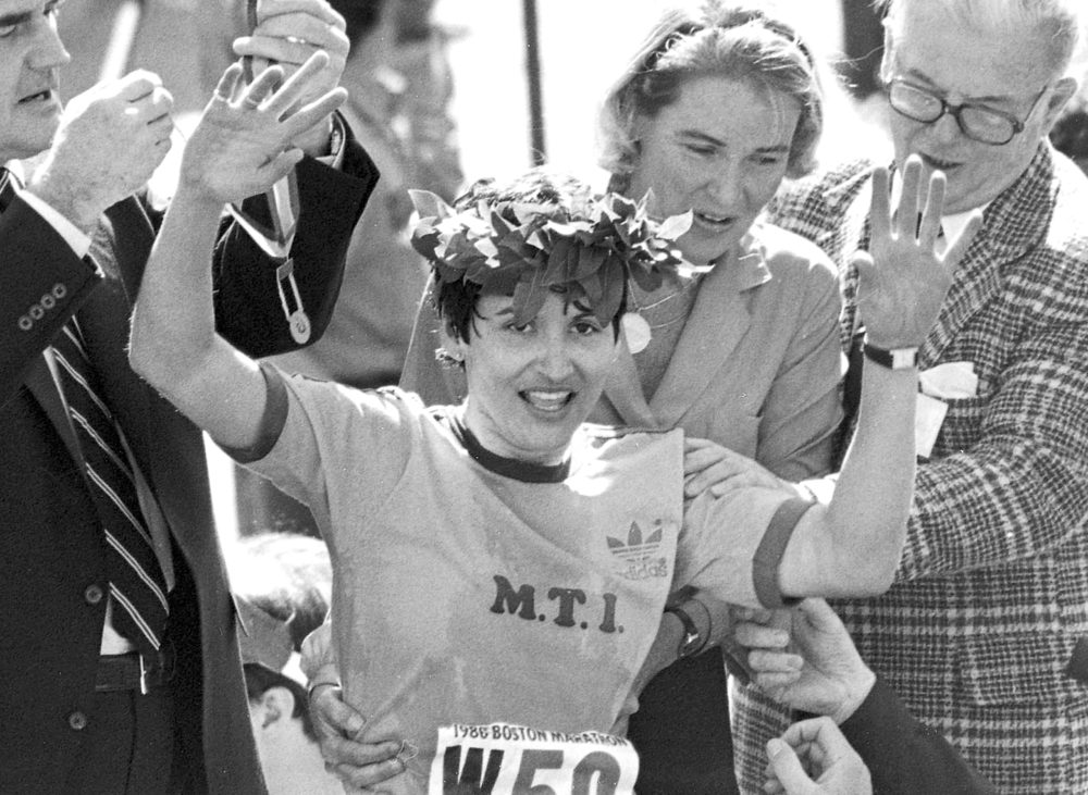 FILE - In this April 21, 1980 file photo, Rosie Ruiz waves to the crowd after after being announced as winner of the women's division of the Boston Marathon in Boston. Her title was stripped eight days later when it was found that she had not run the entire course. Ruiz died July 8, 2019 in Florida. She was 66. (AP Photo/File)