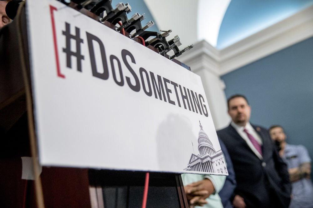 The hashtag &quot;#DoSomething&quot; is displayed as trauma surgeon and gun control activist Dr. Joe Sakran takes the podium during a news conference calling for Senate action on H.R. 8 - Bipartisan Background Checks Act of 2019, on Capitol Hill in Washington, Tuesday, Aug. 13, 2019. (Andrew Harnik/AP)