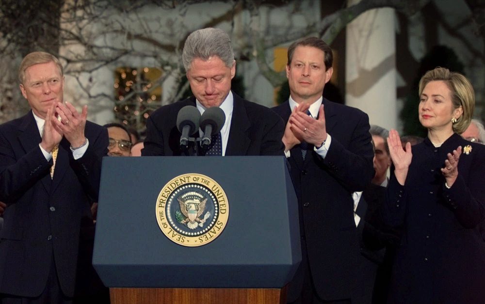 President Clinton receives applause as he makes remarks to Democratic lawmakers after the House of Representatives voted to impeach the president, Saturday Dec. 19, 1998. (Doug Mills/AP)