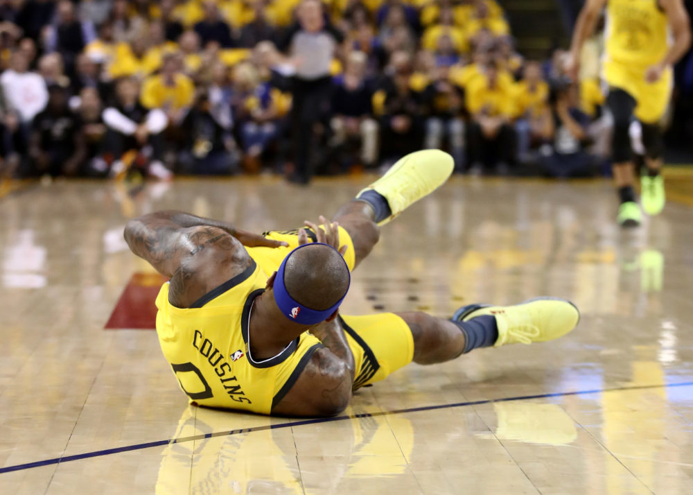 DeMarcus Cousins falls to the ground crowd after tearing his quadriceps on April 15, 2019. (Ezra Shaw/Getty Images)