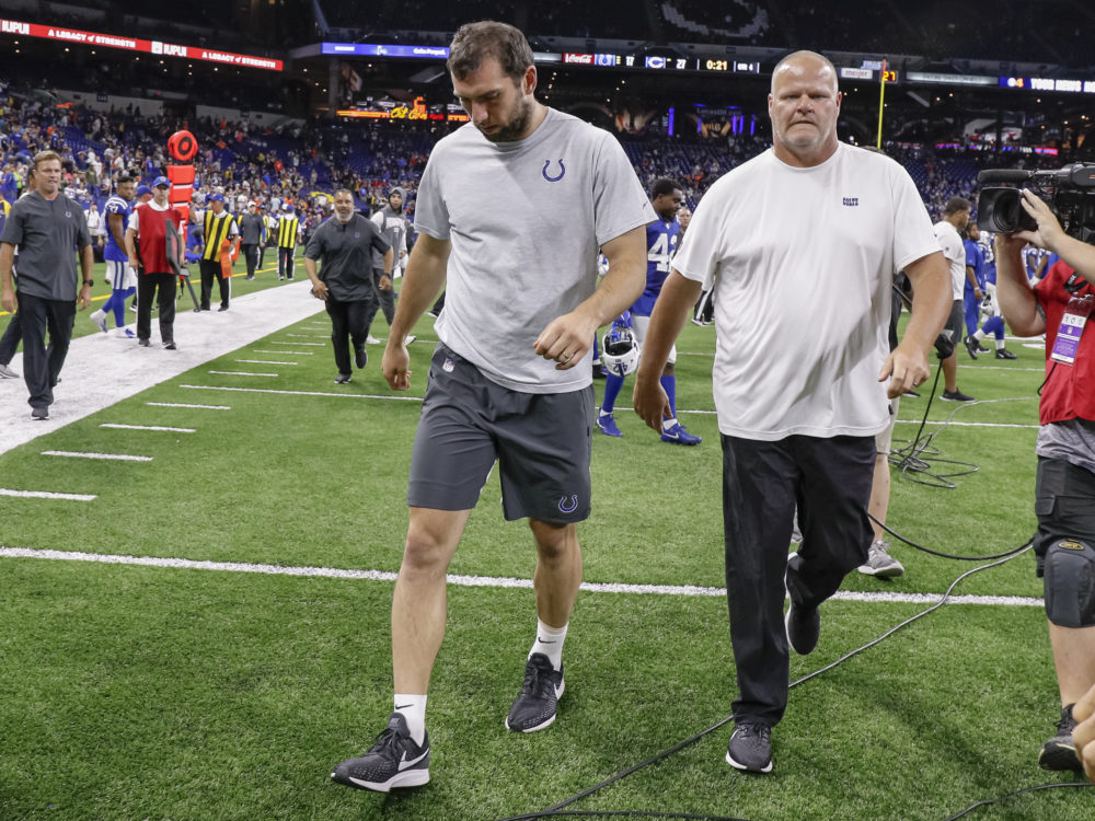 Andrew Luck of the Indianapolis Colts walks off the field following reports of his retirement from the NFL. (Michael Hickey/Getty Images)