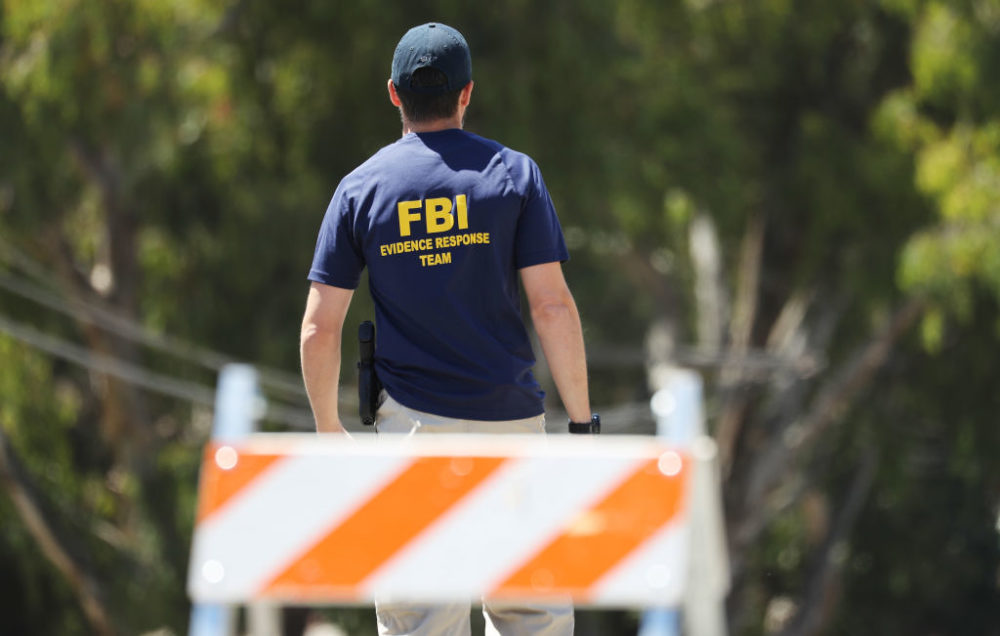 An FBI agent walks toward the site of the Gilroy Garlic Festival after a mass shooting there on July 29, 2019 in Gilroy, California. (Mario Tama/Getty Images)