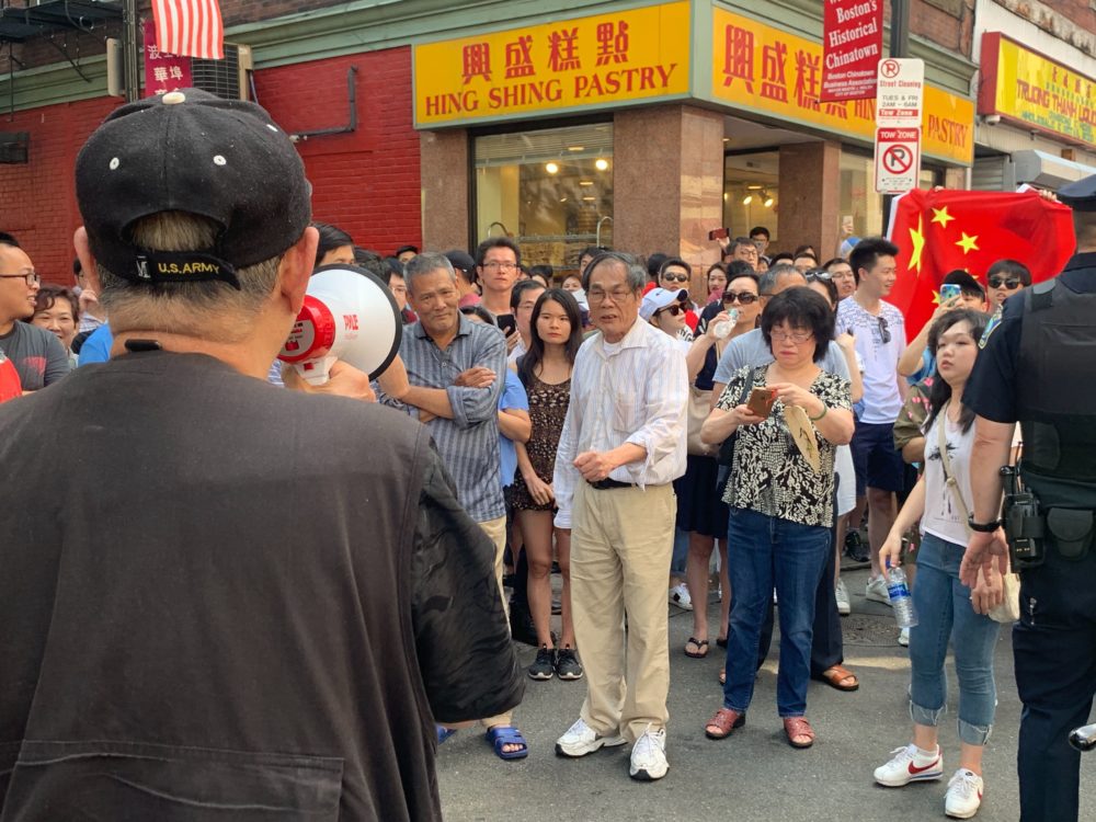 Protesters filled the streets of Boston's Chinatown to show solidarity with Hong Kong on Sunday, but a counterprotest became large, causing tensions to flare between the two sides. (Simón Rios/WBUR)