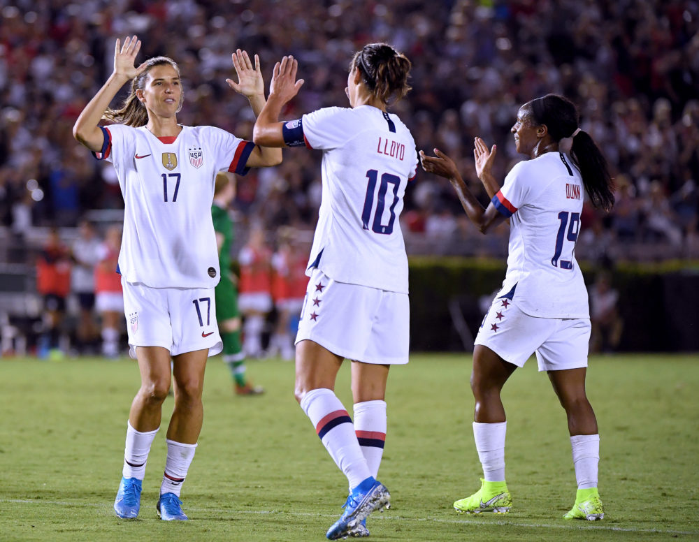 Carli Lloyd celebrates a goal with Tobin Heath and Crystal Dunn during the first half of the first game of the USWNT Victory Tour on Aug. 03 in Pasadena. (Harry How/Getty Images)