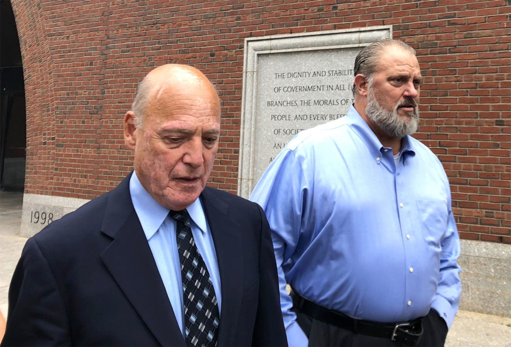 Former state police union chief Dana Pullman, right, leaves federal court in Boston with his lawyer, Martin Weinberg in August. (Chris Lisinski/State House News Service)