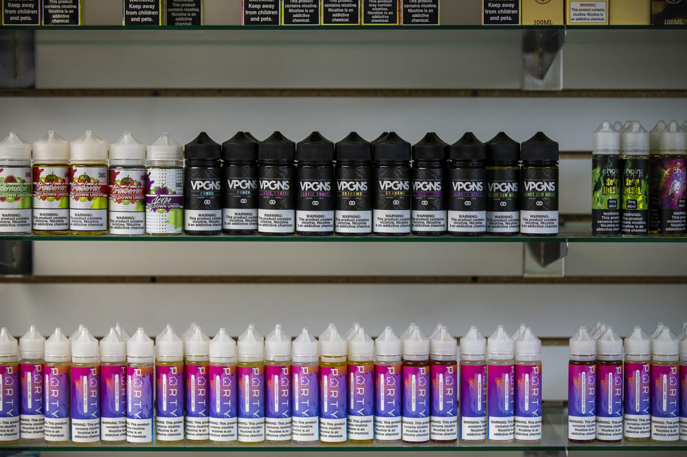 Various vaping juices available at Fast Eddie's Smoke And Vape Shop in Allston which will no longer be available after Governor Baker's declaration for a four-month temporary ban on all vaping products. (Jesse Costa/WBUR)