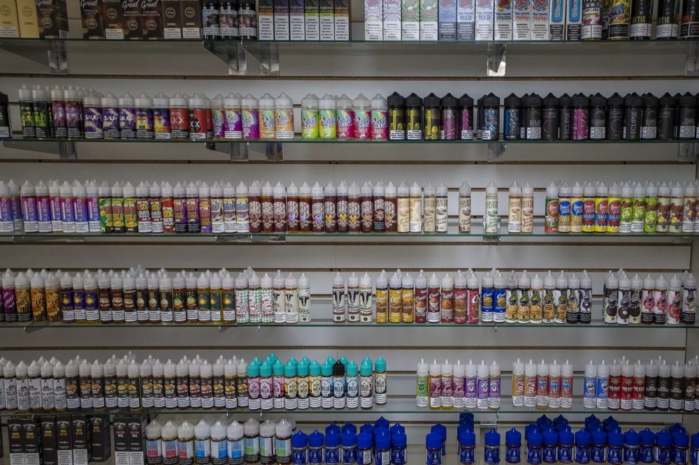 A huge selection of vaping juices at Liquid Smoke and Vape Shop in Allston that can no longer be legally sold. (Jesse Costa/WBUR)