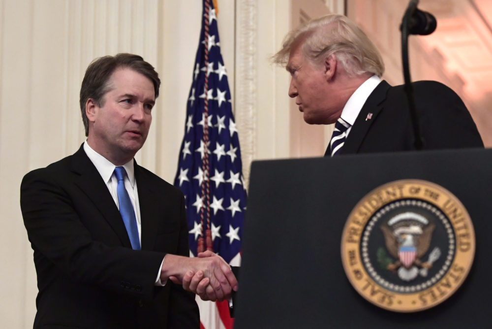 President Trump shakes hands with Supreme Court Justice Brett Kavanaugh before a ceremonial swearing in in the White House on Oct. 8, 2018. (Susan Walsh/AP)