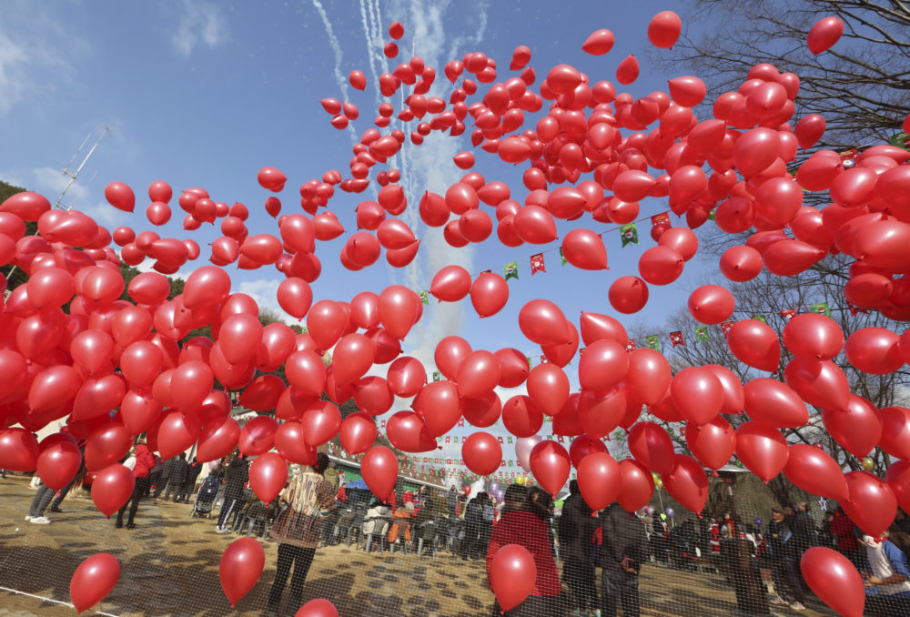 Some say releasing balloons for remembrance or celebration is an overlooked form of littering. (Ahn Young-joon/AP)