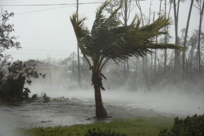 A road is flooded during the passing of Hurricane Dorian in Freeport, Grand Bahama, Bahamas, Monday, Sept. 2, 2019. Hurricane Dorian hovered over the Bahamas on Monday, pummeling the islands with a fearsome Category 4 assault that forced even rescue crews to take shelter until the onslaught passes. (Tim Aylen/AP)