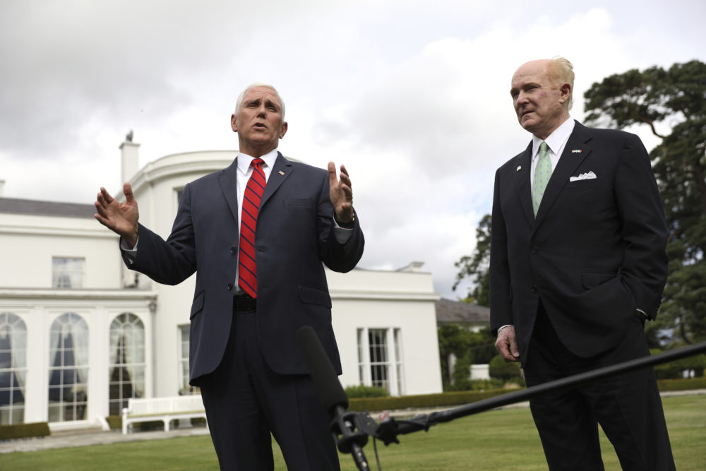 Vice President Mike Pence, left, and U.S. Ambassador to Ireland Edward Crawford speak to the media at the ambassador's residence in Dublin on Tuesday. Pence did not stay in Dublin. (Peter Morrison/AP)