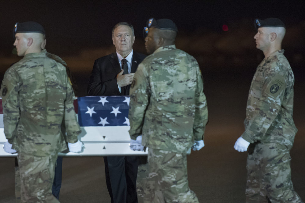 An Army carry team moves a transfer case containing the remains of Sgt. 1st Class Elis Barreto Ortiz, 34, from Morovis, Puerto Rico, past Secretary of State Mike Pompeo, Saturday, Sept. 7, 2019, at Dover Air Force Base, Del. According to the Department of Defense, Ortiz was killed in action Sept. 5, when a vehicle-borne improvised explosive device detonated near his vehicle in Kabul, Afghanistan. Ortiz was supporting Operation Freedom's Sentinel. (Cliff Owen/AP)