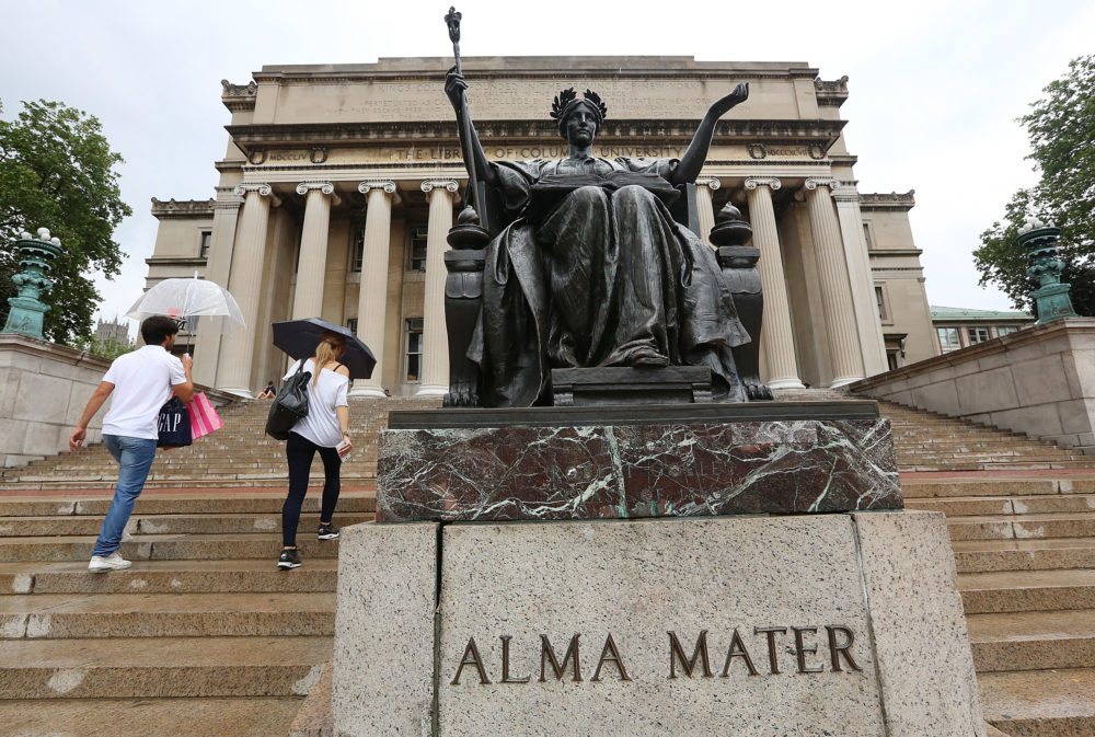 People walk past the Alma Mater statue at Columbia University. In 2018, the school was the second most expensive four-year private non-profit institution, according to the Chronicle of Higher Education. (Mario Tama/Getty Images)