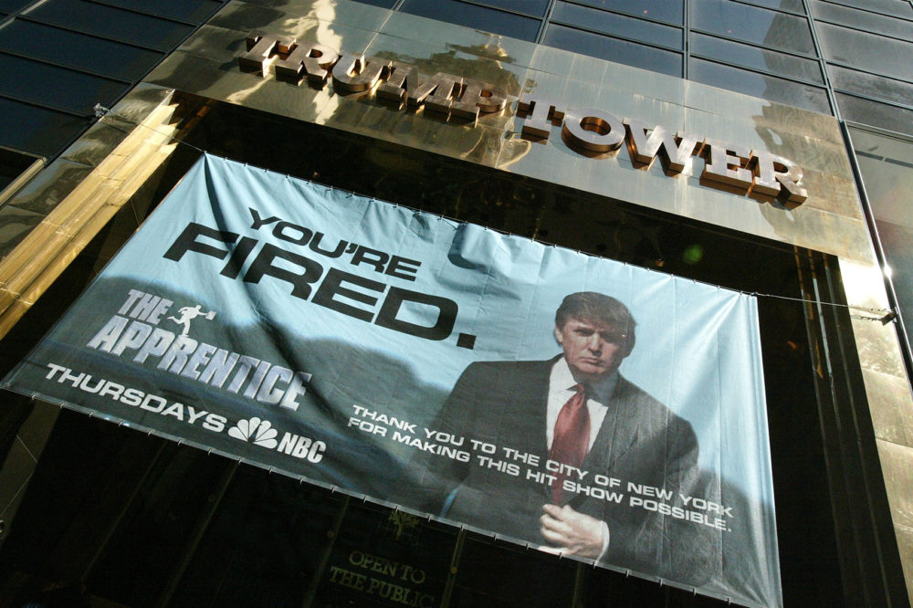 A sign advertising the television show &quot;The Apprentice&quot; hangs at Trump Towers April 15, 2004 in New York City. (Peter Kramer/Getty Images)