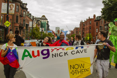 Nick Cave leads a parade through the South End in 2019. (OJ Slaughter for WBUR)