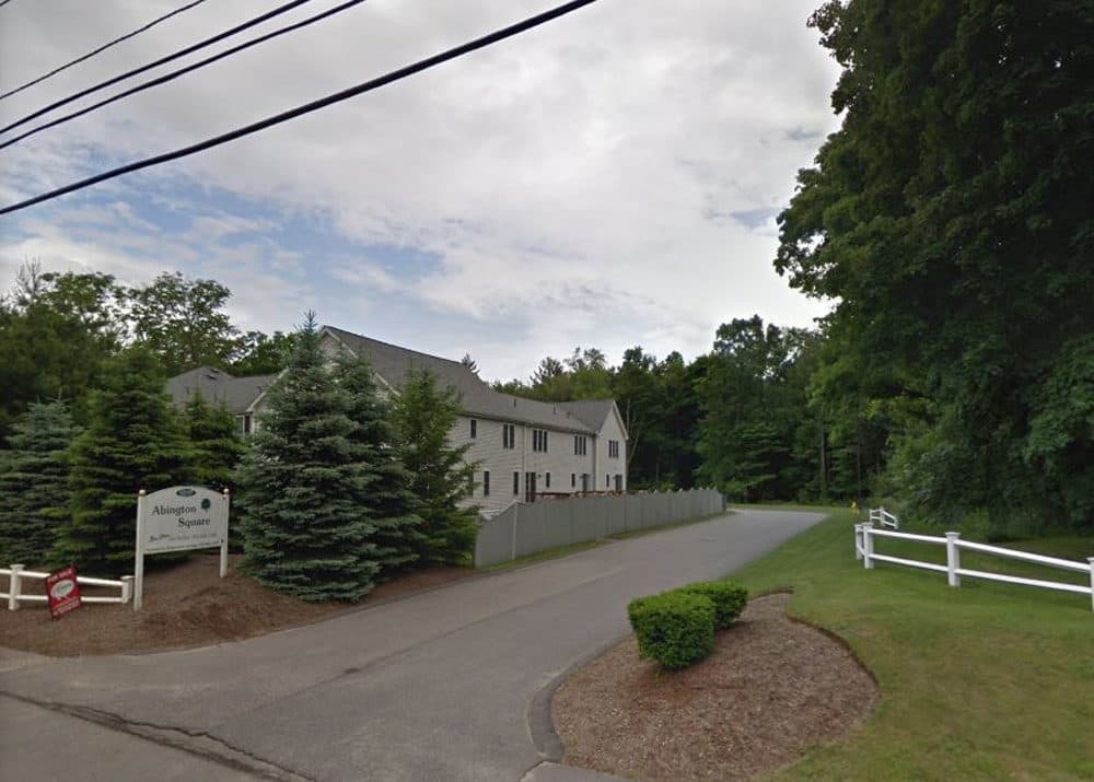 This Google Street View image shows Abington Square Condominium Development, which include 135 Center Avenue. Plymouth County District Attorney Tim Cruz says a family of five was found dead there Monday morning. (Courtesy of Google Maps)