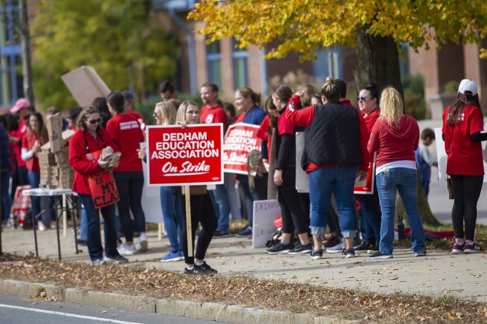 Dedham teachers striking out in front of the Dedham Middle School. (Jesse Costa/WBUR)