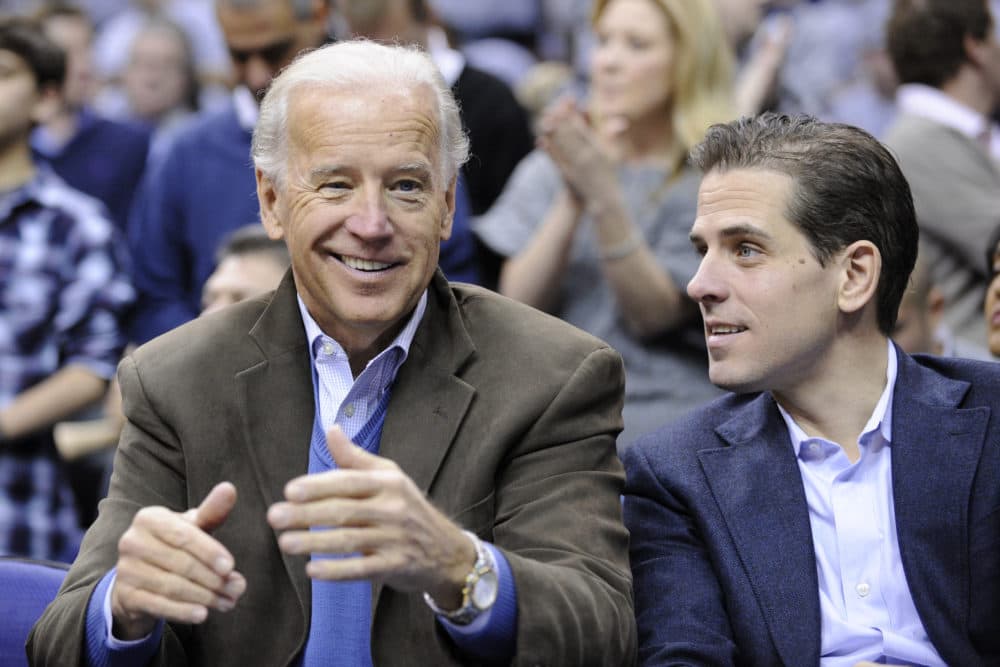 Former Vice President Joe Biden with his son Hunter at the Duke Georgetown NCAA college basketball game in 2010. (Nick Wass/AP)