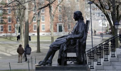 In this 2018 photo, the John Harvard statue looks over Harvard Yard at Harvard University. (Charles Krupa/AP)