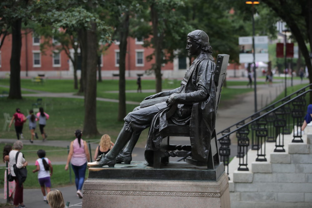 The statue of John Harvard in Harvard Yard at Harvard University in Cambridge, Mass., Tuesday, Aug. 13, 2019. (Charles Krupa/AP)