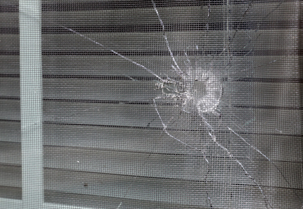 A bullet hole from a police officer's shot is seen in the rear window of Atatiana Jefferson's home in Fort Worth, Texas, Tuesday, Oct. 15, 2019. (Tony Gutierrez/AP)