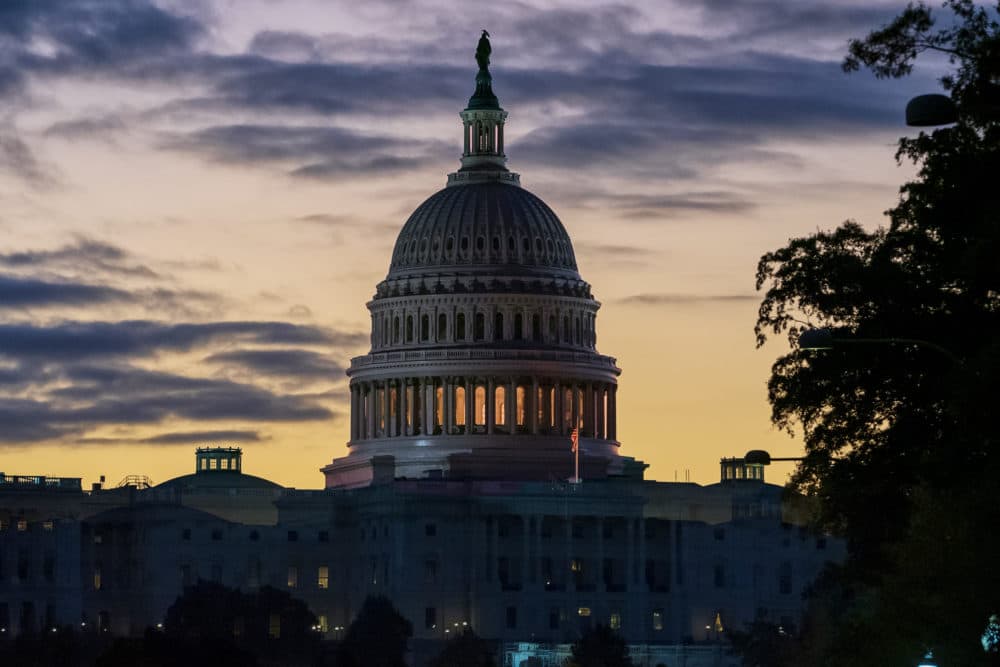 The Capitol is seen at dawn on the morning after Speaker Nancy Pelosi, D-Calif., announced the House of Representatives will vote on a resolution to affirm the impeachment investigation, (J. Scott Applewhite/AP)