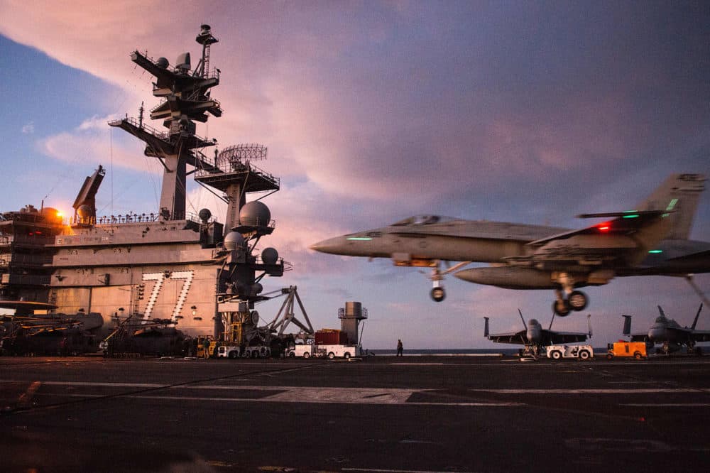 An F/A-18 Hornet lands on the deck of the U.S.S. George H.W. Bush in the Atlantic ocean on Oct. 25, 2017. (Andrew Caballero-Reynolds/AFP/Getty Images)