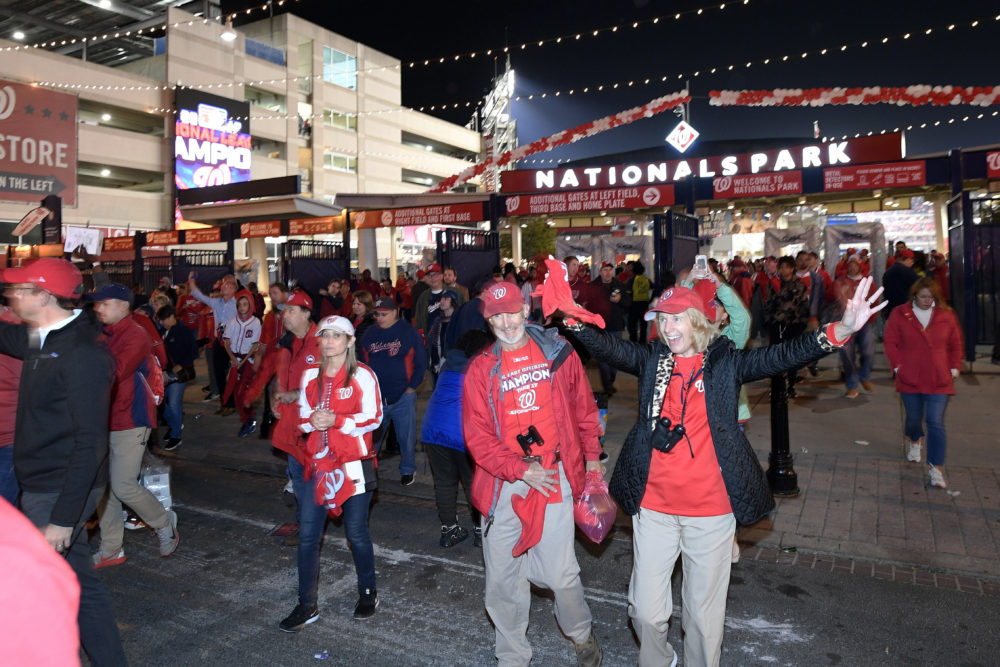 Washington Nationals fans leave the ballpark after the Nats swept the Cardinals in the NLCS. (Nick Wass/AP)