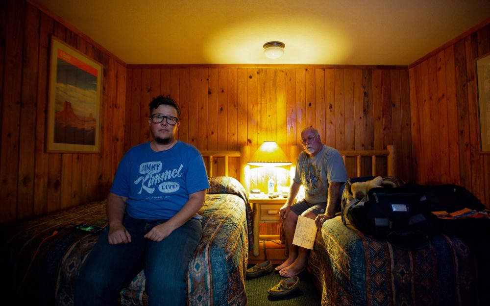 Chick McClure and Chas McClure (back) sit in a hotel during their road trip in Utah. (Courtesy T. Chick McClure)