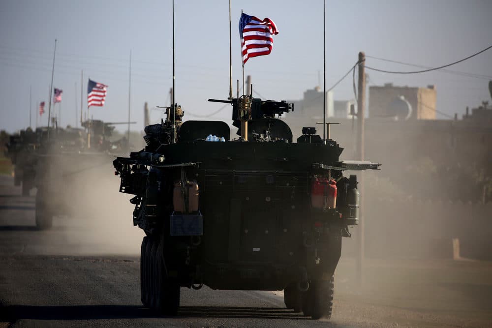 A convoy of US forces armoured vehicles drives near the village of Yalanli, on the western outskirts of the northern Syrian city of Manbij, on March 5, 2017. (Delil Souleiman/AFP/Getty Images)